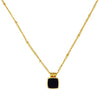 Elegante, goldene Halskette mit schwarzem Anhänger