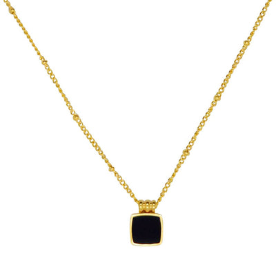 Elegante, goldene Halskette mit schwarzem Anhänger
