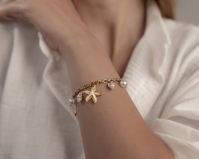 Maritimes Armband mit echten Kegelschnecken und Perlen